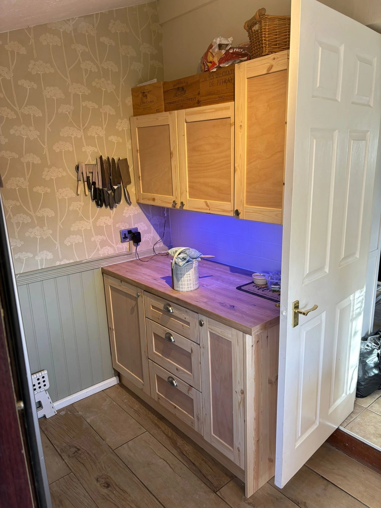 Fitted kitchen with solid timber units and under-cabinet lighting installed by Acorn in a Norfolk home